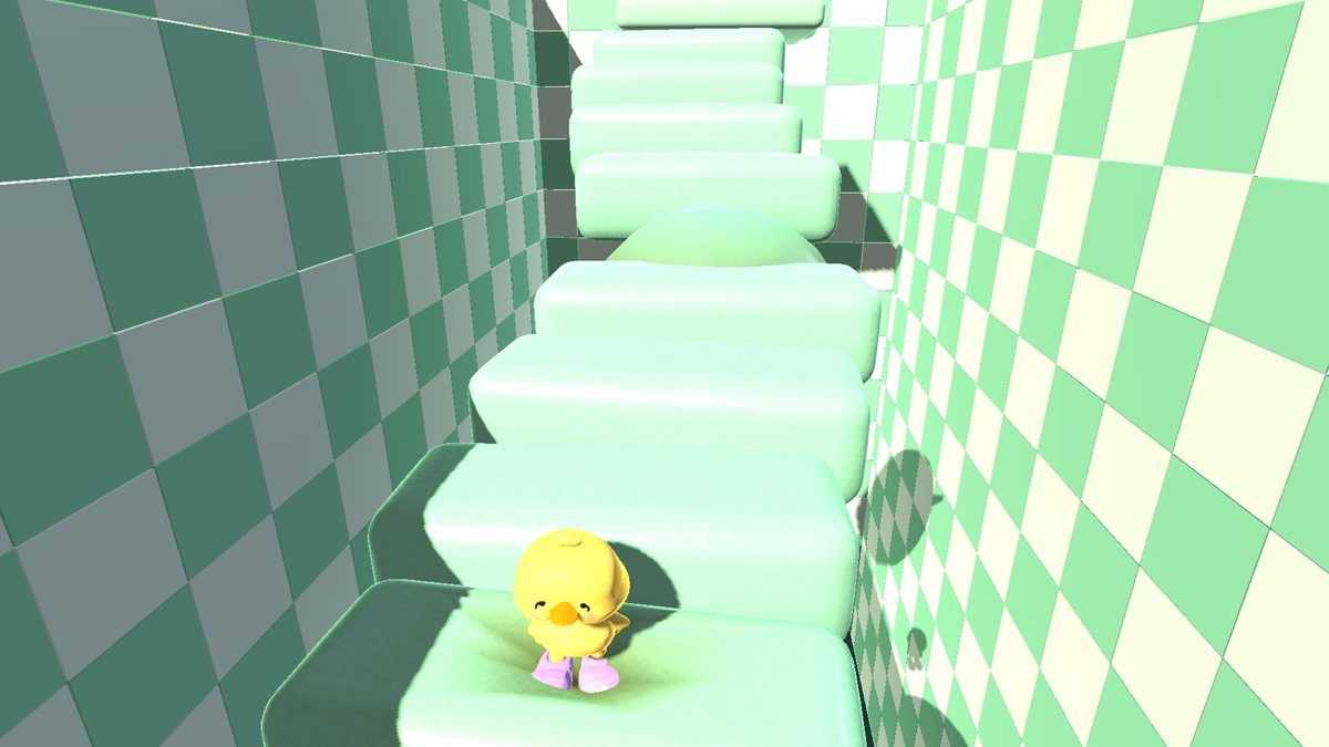 ワクプタワーのプレイ画面。黄色いヒヨコが緑色のゼリーのような階段の上に立っている